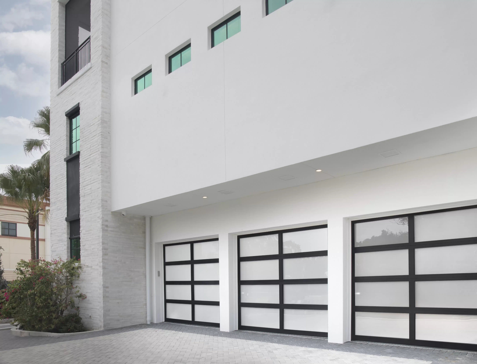 Modern glass garage doors installed by Sunshine State Garage Pros
